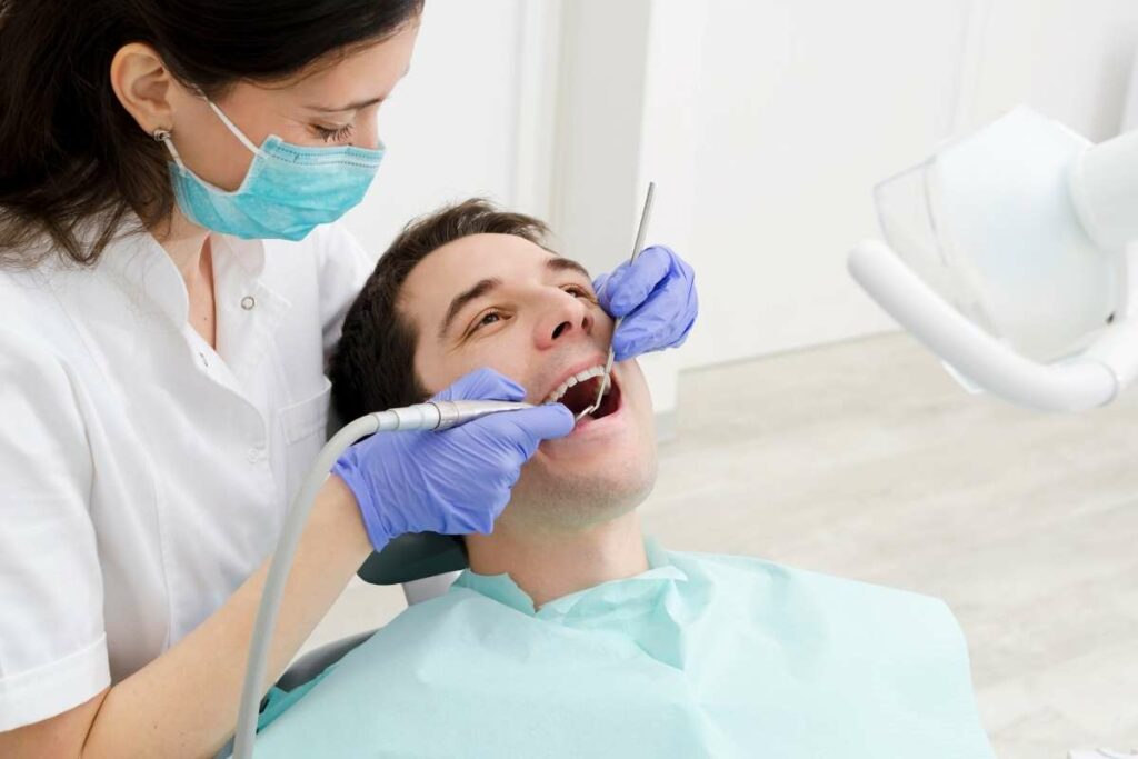 Solo Dental Hygienist working on patient